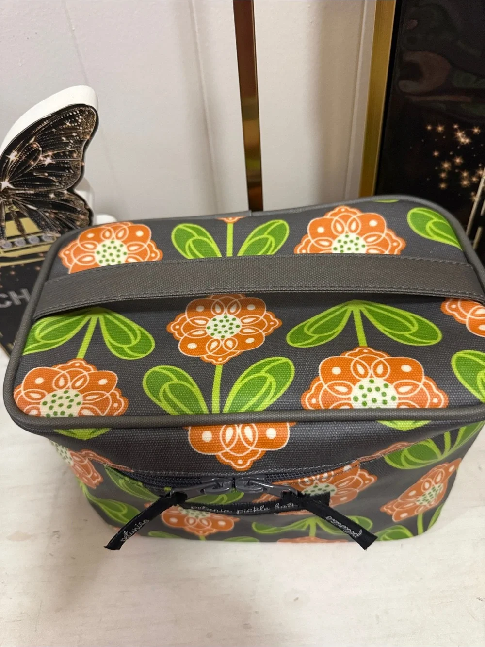 Petunia Pickle Bottom Gray Cosmetic Case with Orange Floral & Green Leaves